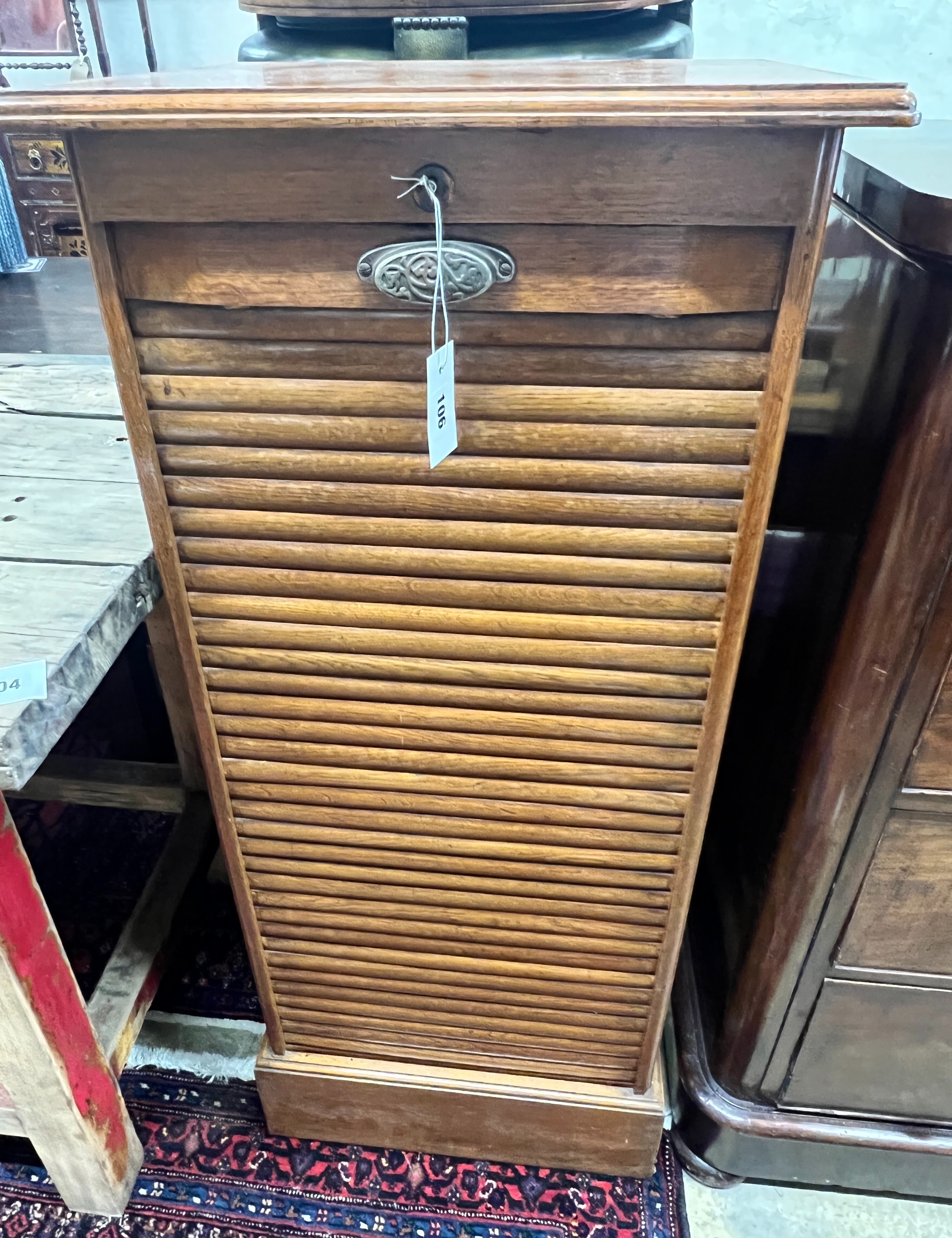 An early 20th century oak tambour filing cabinet, width 50cm, depth 42cm, height 115cm